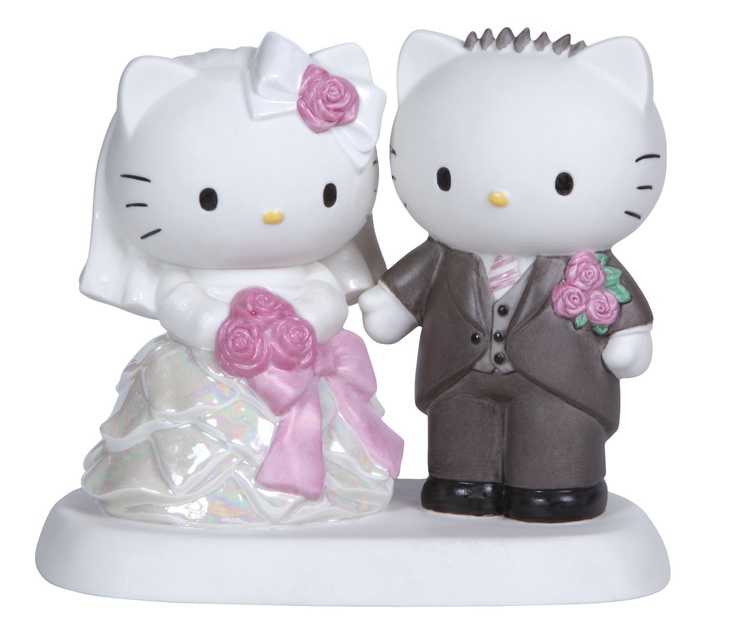 a hello kitty wedding cake topper with a bride and groom in tuxedo