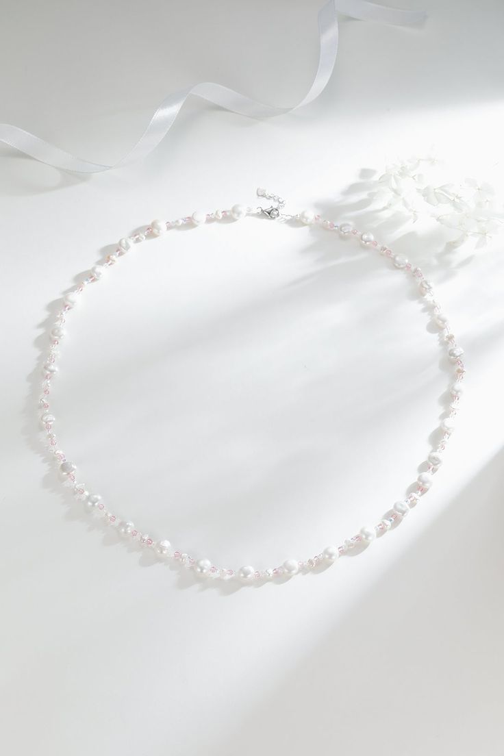 Baroque Freshwater Pearl Necklace with Pastel Beads Embrace youthful charm with our Baroque Freshwater Pearl Necklace, adorned with delightful pink and white beads. This necklace's playful colors evoke a sense of joy and beauty. Measuring 68cm with an additional 3cm extension, it offers versatility, allowing you to style it as a bracelet too. Perfect for casual wear, summer days, weddings, and travel, this necklace brings a fresh and vibrant touch to any occasion. Product Details: Pearl: Freshwa Single Strand Pearl Bridal Necklace With Round Beads, Pearl Bridal Necklace With Single Strand Of Round Beads, Single Strand Pearl White Beaded Necklace, Pearl White Beaded Necklace With Single Strand, Pearl White Beaded Necklaces With Round Beads, Adjustable White Pearl Necklace With Polished Beads, Pearl Necklace With Colorful Beads For Wedding, Elegant White Beaded Necklaces With Colorful Beads, Elegant White Beaded Necklace With Colorful Beads