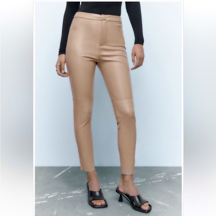 Blogger Fave! Zara Hi-Rise Faux Leather Leggings. High-Waisted. False Front Pockets. Front Zip And Snap Button Closure. Hidden In-Seam Zippers At Hem. Solid Cream Color. Base Fabric: Soft Fabric Inside. Color: Sand Material: 100% Polyester. Coating Material: 100% Polyurethane Approximate Measurements: 12“ Across The Waistband, 11“ Rise, 27“ Inseam Condition: Nwot Tags: Business Casual Casual Winter/Fall/Spring/Summer Fashion Outfit Contemporary Faux Leather Date Night Trendy Tapered Leg Leather Pants For Work, Trendy Fitted Ankle-length Leather Pants, Fall Office Leggings, Fall Night Out Ankle-length Leggings, Non-stretch High Waist Leather Pants For Work, Trendy Stretch Leather Pants For Spring, Trendy Straight Leggings For Spring, Elegant Office Leggings For Fall, Trendy Tight Leather Pants For Spring