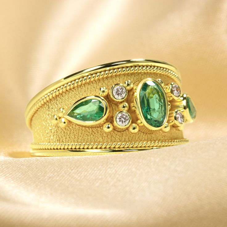 Make an unforgettable entrance with this dazzling gold Emerald Ring - encrusted with dazzling diamonds and fit for royalty! It's the perfect pick to add extravagant style and sparkle to your wardrobe and make an undeniable statement! 100% handmade in our workshop. Metal: 14K Gold| 18K Gold Gemstones: Emeralds | weight 0,68 ct Diamonds | weight 0,08 ct Discover the art of personalization as you select your dream jewelry, choosing the perfect gemstone that resonates with your unique style. Our ded Gold Emerald Ring With Pave Setting, Gold Emerald Diamond Ring With Accents, Gold Emerald Ring With Pavé Setting, Luxury Gold Emerald Ring For Formal Occasions, Luxury Diamond Ring With Sparkling Stones For Party, Elegant Gold Emerald Ring For Wedding, Exquisite Emerald Ring With Pave Setting For Wedding, Luxury Yellow Gold Emerald Ring With Single Cut Diamonds, Luxury Party Diamond Ring With Sparkling Stones