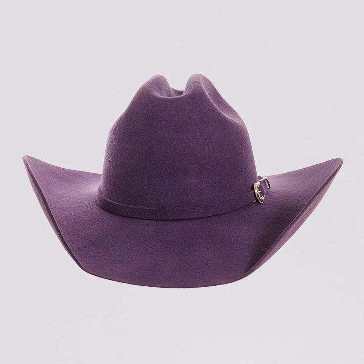 Introducing the Cattleman Womens Felt Cowboy Hat, a true iconic Cattleman-shaped crown with a shovel brim for that Yellowstone Dutton Ranch Hat look. Offered by American Hat Makers means that you can rest easy because it is backed by our 50 years of experience and Lifetime Guarantee. Featuring a sewn-in sweatband with a unique hidden pull strap tightening system for a one of a kind fit! Plus we’ll include two adhesive size reducers for an even more custom experience. Brim 4" Crown 4 3/4" Midweig Colored Felt Cowboy Hats, Purple Cowboy Hat, Tropical Goth, Lane Frost, White Cowboy Hat, Brown Cowboy Hat, Yellowstone Dutton Ranch, Felt Cowboy Hat, Hats For Big Heads