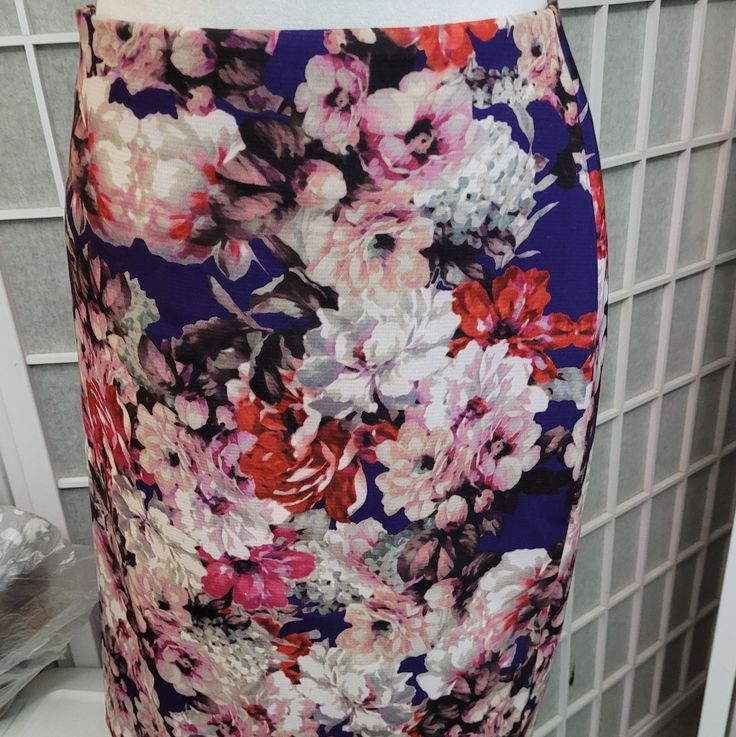 Lined Talbots Skirt In Floral Print In Reds, Pinks, Cream On Dark Purple Background. Purple Lining, Hidden Back Zip, Size 14p. Would Look Great With A Purple, Cream Or Cranberrycsweater Or Top For The Fall. Never Worn. Nwt Purple Floral Print Mini Skirt, Purple Floral Print Skirt For Spring, Fitted Floral Print Purple Bottoms, Spring Purple Floral Print Skirt, Purple Floral Skirt For Spring, Lined Purple Pencil Skirt, Purple Lined Pencil Skirt, Teal Skirt, Dark Purple Background