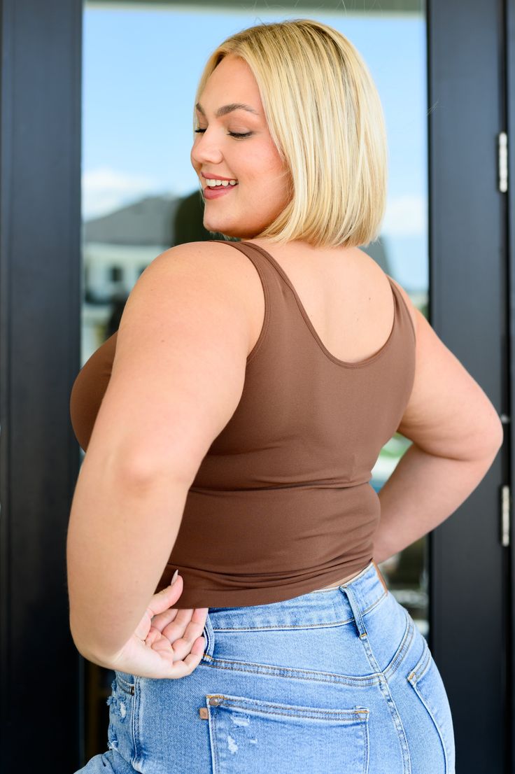 Feeling confident and comfortable has never been easier than in our Carefree Seamless Reversible Tank in Brown! The ultra stretchy, buttery soft fabric shapes a v-neckline with a sleeveless cut and fitted silhouette that ends at a slightly cropped hem. Stretchy Buttery Soft Fitted Silhouette 92% Nylon, 8% Spandex True to size OS: Chest 26" Length 18.5"PLUS: Chest 32" Length 19" Model Jordan is wearing size PLUS Feeling Confident, Judy Blue Jeans, Graphic Tops, Beauty Sale, Hair Accessories Jewelry, Denim Leggings, Romper Dress, Fitted Silhouette, Chic Boutique