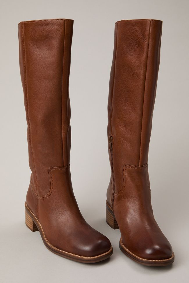 Put your best foot forward with this contemporary boot that strikes a balance between fashion-forward and timeless thanks to its square toe, short stacked block heel, and luxe leather craftsmanship. Wide Calf Heeled Boots With Stacked Block Heel, Brown Knee-high Boots With Stacked Heel And Square Toe, Brown Knee-high Boots With Stacked Block Heel, Brown Heeled Boots With Block Heel, Casual Mid-calf Boots With Stacked Block Heel, Modern Leather Knee-high Boots With Block Heel, Wide Calf Leather Boots With Stacked Heel, Modern Leather Mid-calf Boots With Block Heel, Modern Leather Knee-high Boots With Stacked Heel