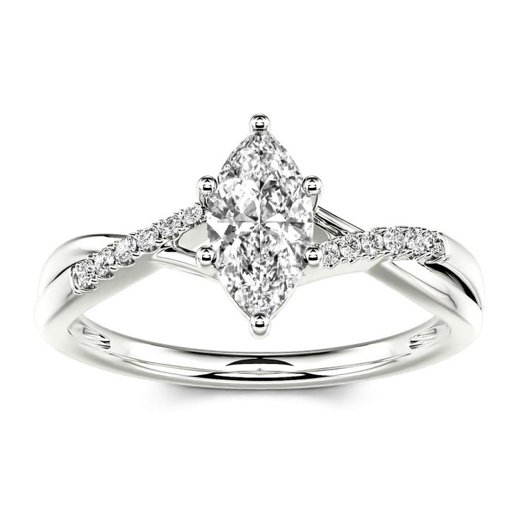 a white gold ring with a pear shaped diamond