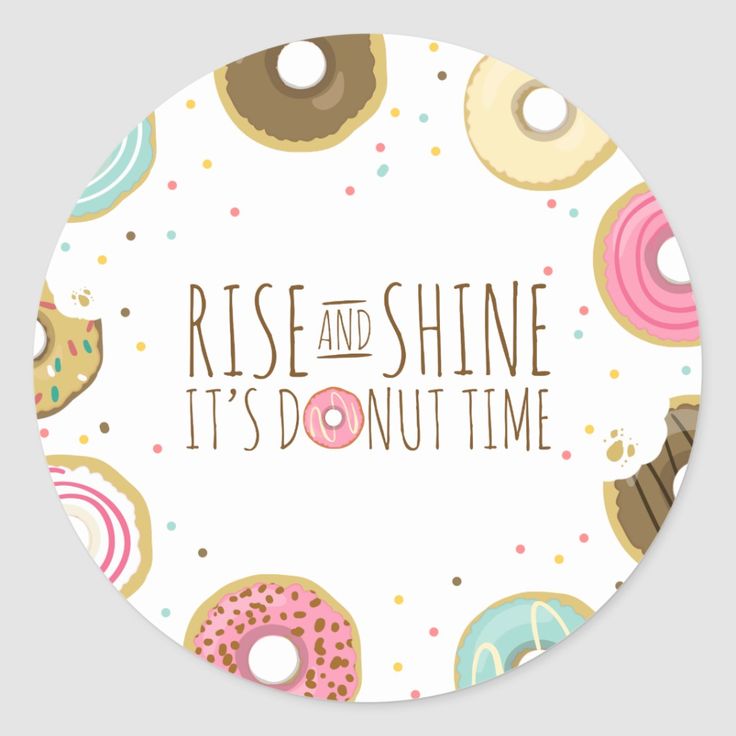 a white plate with donuts on it that says rise and shine it's donut time