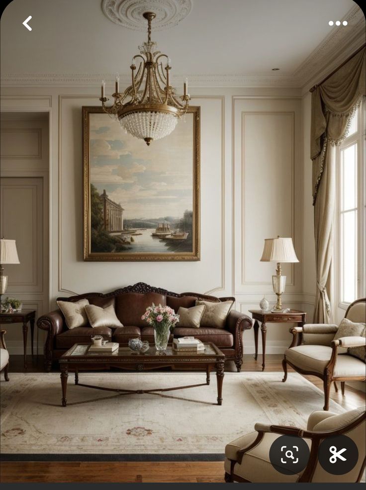 a living room filled with furniture and a chandelier