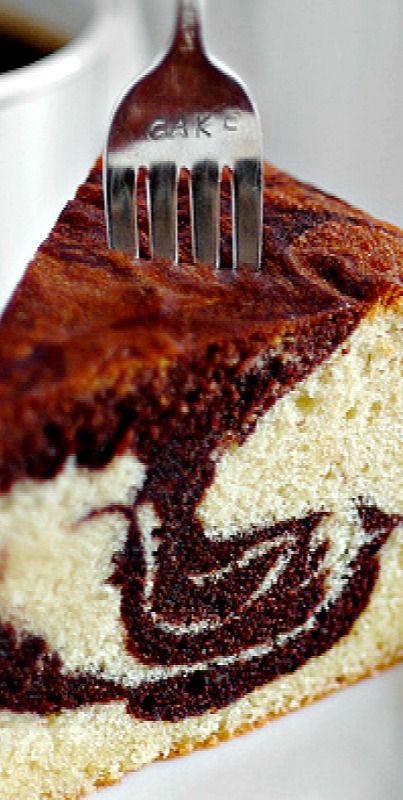 a piece of cake on a plate with a fork stuck in it