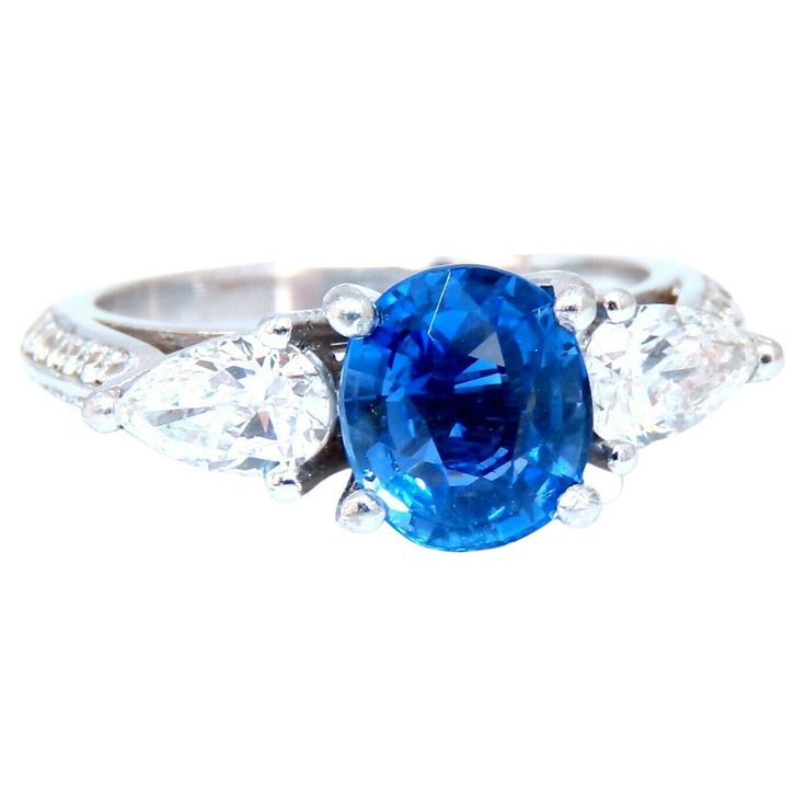 GIA Certified: 2.13ct. Natural No Heat blue sapphire ring. Full cut brilliant oval cut Clean clarity Transparent and vibrant top Bright Gem Royal Blue 7.92 X 6.94 x 4.27mm Report # 1206133411 .70ct. Natural Diamonds Pears, full cut G-color vs-2 clarity .60ct. Natural Diamonds Rounds, full cut G-color vs-2 clarity Platinum 8.5 Grams Ring Depth 9mm Current ring size: 7 May resize, please inquire $55,000 appraisal will accompany Blue Oval Sapphire Ring With Vvs Clarity, Oval Blue Sapphire Ring With Vvs Clarity, Gia Certified Oval Lab-created Sapphire Ring, Blue Sapphire Ring, Golden Ring, Diamonds Ring, Sapphire Diamond Ring, No Heat, Blue Sapphire Rings