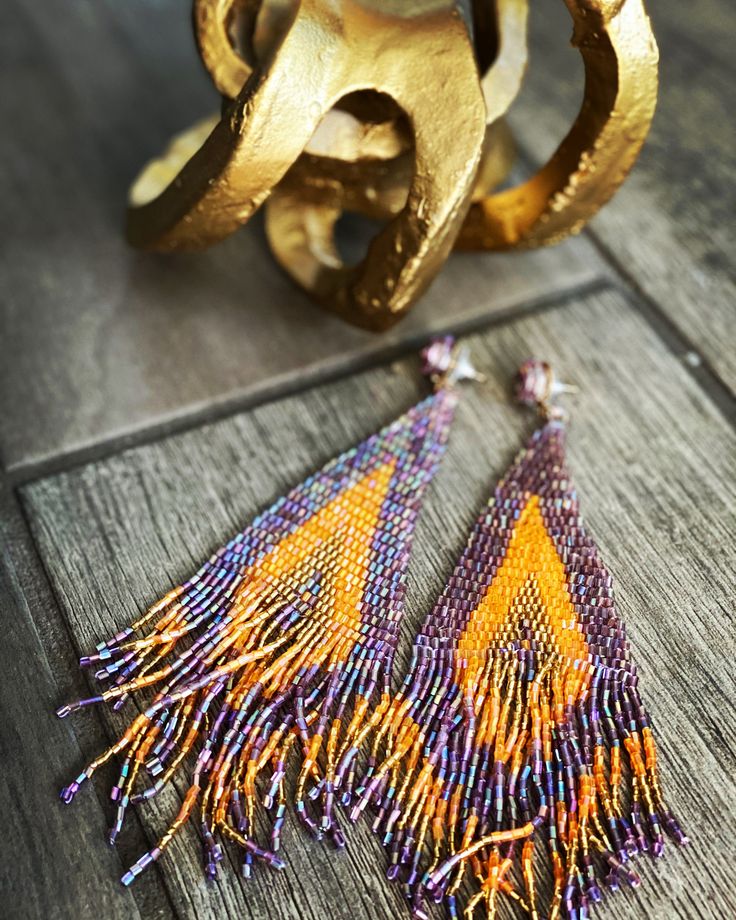 This is a bohemian long tassel earring. Features: Hanging Style Earring. Weight is 1.1 oz. Comes in a jewelry gift box. Handmade Bohemian Long Drop Earrings, Multicolor Tassel Drop Earrings, Purple Tassel Earrings With Dangling Beads For Gift, Gift Purple Tassel Earrings With Dangling Beads, Adjustable Tassel Earrings As Gift, Handmade Artisan Tassel Earrings As Gift, Handmade Artisan Tassel Earrings For Gift, Multicolor Tassel Earrings As A Gift, Artisan Handmade Tassel Earrings For Gift