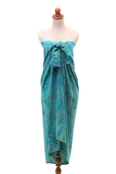 Possessing a rainy vibe this rayon sarong is presented by Mayda in Bali. Hues of blue and cerulean contrast with dotted motifs in tan achieved using the batik method where the fabric is hand-stamped with a wax resist before being treated with colorful dyes. Blue Batik Print Sarong For Summer, Summer Blue Batik Print Sarong, Green Batik Print Sarong For Beach, Bohemian Green Sarong For Pool, Blazers Casual, Batik Sarong, Sarong Dress, Casual Blazer Women, Batik Art