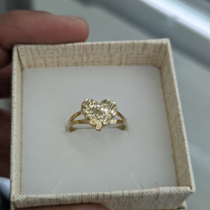 10kt Real Gold Nugget Ring Size 8 Weight 1.44 Gm Heart Size 11.5*10.5 Please Check The Picture Carefully To Understand The Size Of The Heart And Ring 100% Authentic Gold Not A Gold Filled Or Not A Gold Plated Never Change Color Or Never Fade Never Tarnish Comes In A Gift Box. Gold Ring Chunky, Heart Nugget Ring, Yellow Gold Heart Ring With Diamond Cut, 14k Gold Nugget Ring Gift, Formal 14k Gold Heart Ring Stamped 14k, Tarnish Resistant Gold Heart Ring For Anniversary, Yellow Gold Diamond Cut Heart Ring For Anniversary, Diamond Cut Nugget Ring For Gift, Gold Heart Ring Stamped 14k For Valentine's Day