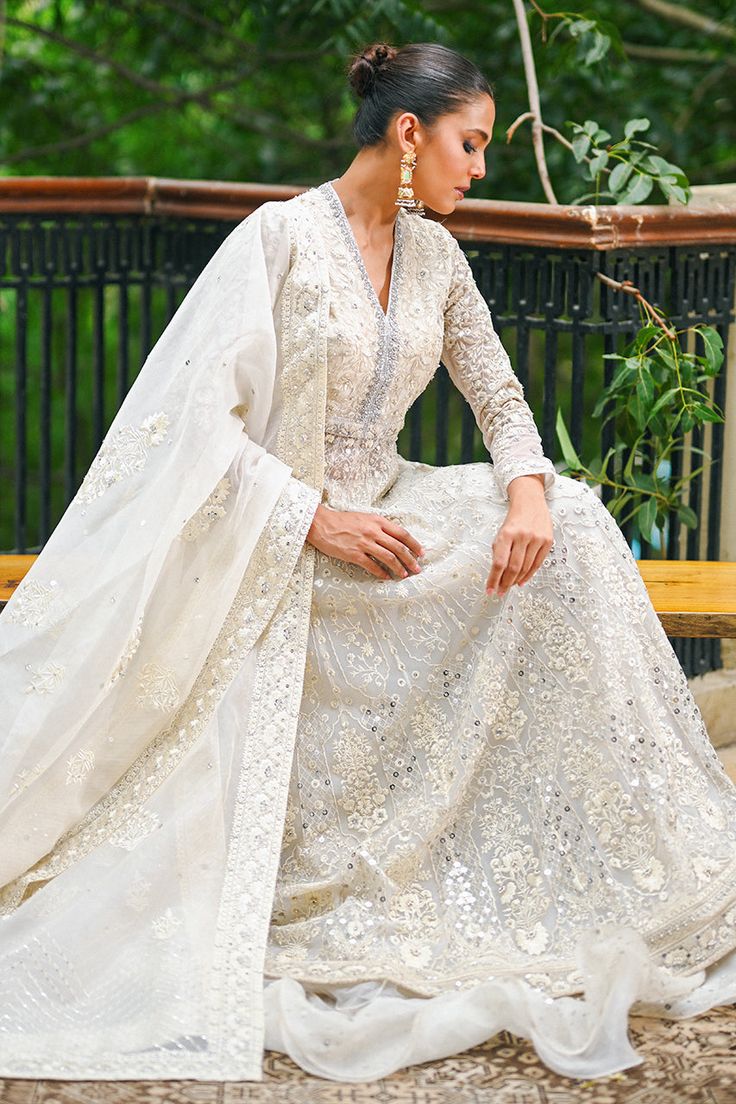 This elegant ivory peshwas with zardoze and sequin work is the ideal look to stay elegant yet festive. Style it with a worked organza dupatta and a ruffled tulle skirt of net. Sania Maskatiya, Nikah Dress, Website Features, Organza Dupatta, How To Dye Fabric, Digital Photography, Full Set, Western Fashion, Tulle Skirt