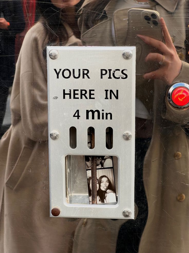 there is a sign that says your pics here in 4 minutes on the phone