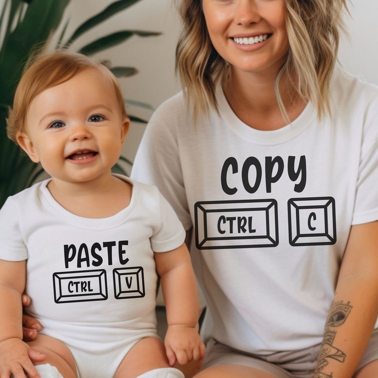 Behold our Ctrl C and Ctrl V matching set - a delightful fusion of copy-paste flair for both parent and baby! Whether you're commemorating a christening, on the hunt for the perfect baby gift, or gearing up for the much-anticipated Fathers and Mothers Day, this charming duo is set to steal the show. **Parent T-Shirt (Ctrl C Indulge in comfort with our adult T-shirt, meticulously crafted from a medium-weight 100% cotton fabric for year-round cosiness. The classic fit ensures a laid-back wear suitable for any occasion - be it casual gatherings or semi-formal affairs. The crew neckline adds a touch of timeless elegance, ensuring this tee effortlessly blends into your versatile wardrobe. But our commitment goes beyond style - this tee is fashioned from 100% US cotton, responsibly grown and har White Tops With Funny Print For Playtime, White Tops With Custom Parenting Print, White Tops With Custom Print For Parenting, White Top With Custom Parenting Print, White Top With Custom Print For Parenting, Thoughtful Baby Gifts, Animal Humour, Vest Set, Copy And Paste