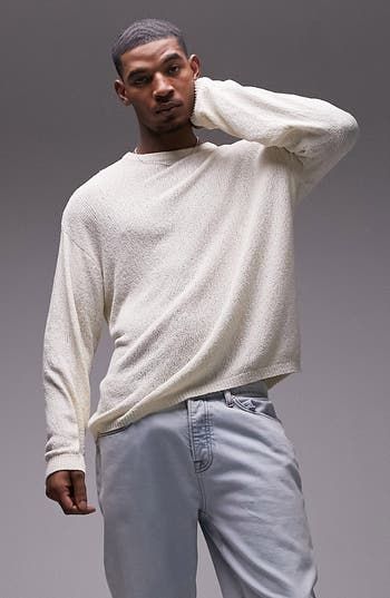 Dropped shoulders frame this slouchy crewneck sweater knit with soft texture. 27 1/2" length (size Medium) Crewneck Long sleeves 86% cotton, 14% nylon Machine wash, line dry Imported