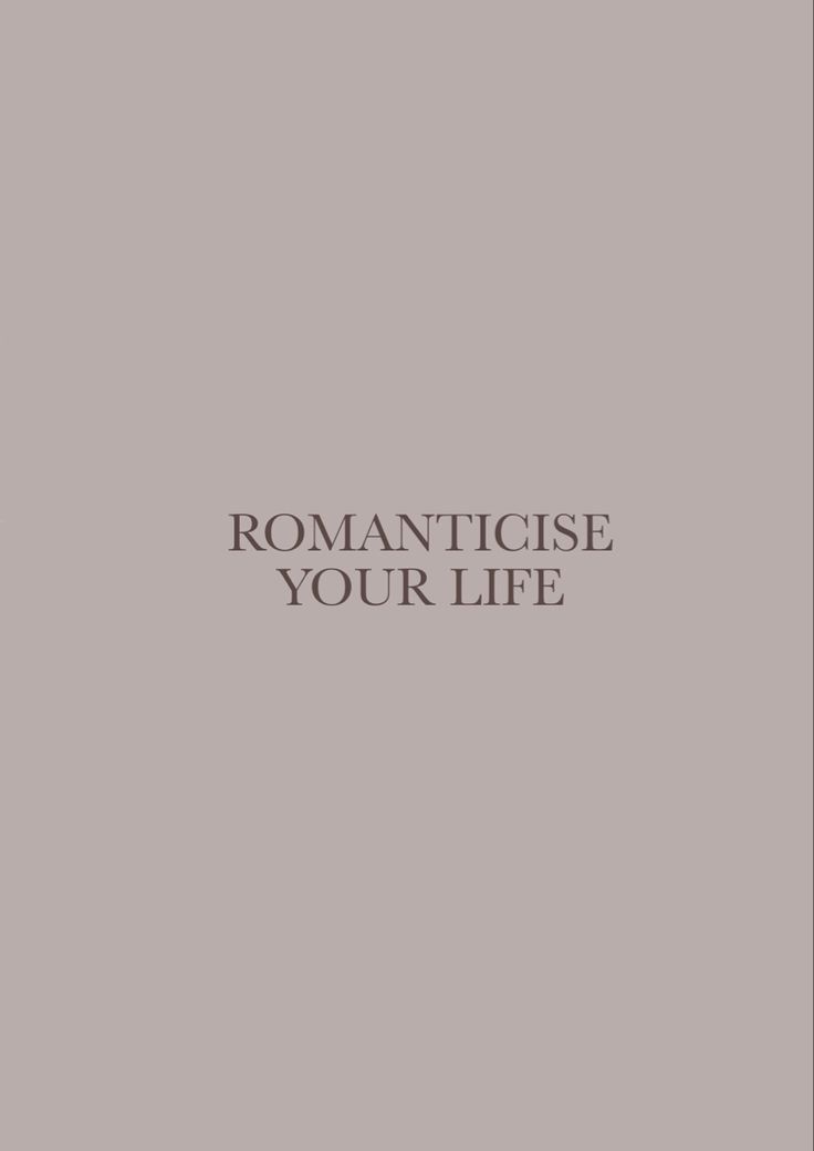 the words romanticise your life are in black and white on a light gray background