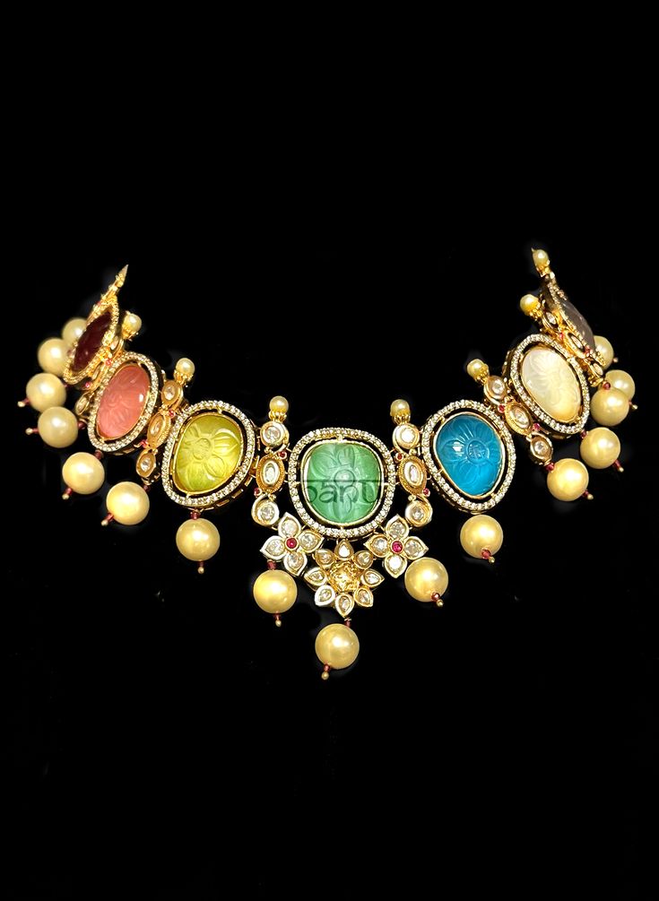 Navratna choker necklace with kundan and pear drops Elegant Multicolor Bridal Sets For Festive Occasions, Fusion Kundan Wedding Sets, Fusion Style Kundan Wedding Sets, Multicolor Kundan Traditional Wear For Reception, Fusion Style Jewelry For Wedding And Navratri, Fusion Style Jewelry Sets For Reception, Elegant Multicolor Bridal Sets With Stone Work, Multicolor Fusion Traditional Wear For Wedding, Fusion Kundan Necklace With Meenakari For Receptions