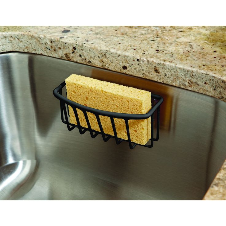 a sponge is sitting on the edge of a sink