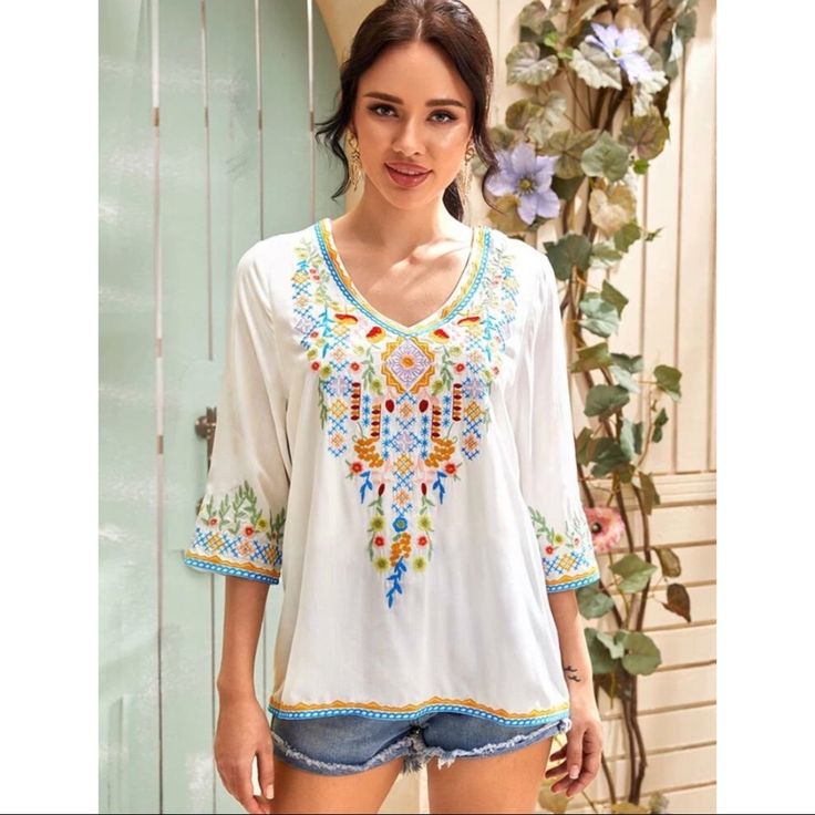 Boho Style Embroidered Tribal Tunic Style Blouse. Three Quarter Sleeve Length, Regular Sleeve, V Neck, Pullover Style, Regular Fit, Non-Stretch. Is Lined One Side Upto High Waist. 97% Rayon, 3% Polyester Perfect For Spring/ Summer Casual V-neck Embroidered Top With Multicolor Embroidery, Summer V-neck Top With Geometric Embroidery, Summer V-neck Blouse With Floral Embroidery, Bohemian V-neck Blouse With Multicolor Embroidery, Casual V-neck Top With Multicolor Embroidery, Casual V-neck Blouse With Geometric Embroidery, V-neck Embroidered Blouse For Vacation, Floral Embroidered V-neck Blouse For Vacation, Printed V-neck Top For Festival