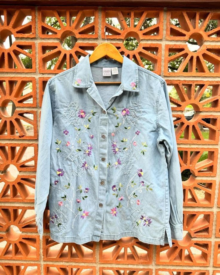 Vintage Haband Button Up Denim Flower Embroidered Ling Sleeve Blouse. Boho Country Large 14/16 Shirt. Pink, green, purple and yellow embroidered flowers. Cotton. L: 28.25" Underarm to underarm: 22" Shoulder to shoulder: 19" shoulder to cuff: 24.5" Check out the rest of our shop: https://instagram.com/hollyshopvintage?igshid=OGQ5ZDc2ODk2ZA== https://hollyshopvintage.etsy.com/ Orders over $35 ship for free. Please check out my Instagram for my newest finds: Hollyshopvintage  Everything priced over Spring Tops With Multicolor Embroidery And Buttons, Embroidered Multicolor Tops With Buttons For Spring, Spring Embroidered Tops With Buttons, Spring Multicolor Embroidered Tops With Buttons, Multicolor Embroidered Top With Button Closure For Spring, Cotton Tops With Multicolor Embroidery And Button Closure, Spring Multicolor Embroidered Top With Button Closure, Spring Embroidered Top With Button Closure, Casual Button-up Blouse With Floral Embroidery