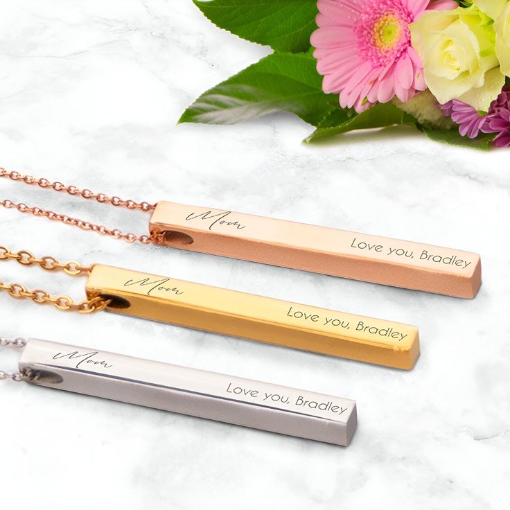 Personalized Pillar Bar Pendant Necklace for Mom in silver, gold and rose gold This elegant Pillar Bar Pendant Necklace is the perfect gift for Mom. If you're looking for a great Mother's day, birthday or just an anytime gift, then this necklace will not disappoint. She'll definitely love this one of a kind gift. The Pillar Bar pendant measures 2" by .25" by .25" with an 18" chain. The "Mom" inscription is done in a beautiful font. Add a personal touch with a laser-engraved message of love that is sure to remind her how much you care every time she wears it. Our necklace comes in 3 different colors, and it is made of stainless steel so it won't fade or rust over time. Get her something she'll love to show off for years to come. All of our products are made with top quality in mind. So, not Engraved Rose Gold Name Necklace For Her, Personalized Rose Gold Bar Necklace As Gift, Personalized Rose Gold Bar Necklace For Gift, Mother's Day Gift Bar Necklace, Personalized Bar Necklace For Mother's Day, Rectangular Rose Gold Jewelry For Birthday Gift, Rose Gold Rectangular Jewelry For Birthday Gift, Rose Gold Stainless Steel Name Necklace For Mother's Day, Minimalist Rose Gold Bar Necklace For Gift