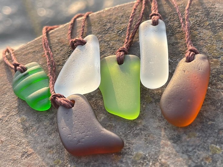 Sea glass necklaces. Reclaimed from the ocean, drilled and made into something new and beautiful. An eco friendly gift for yourself or a loved one.  I have hung them on sustainable hemp. The cord has been left loose so you can tie at your preferred length.  The pendant will arrive in a smart recycled gift box.  If purchasing as a present, recycled handmade cards are also available in my shop. I would be happy to add a message of your choice if you wish me to post direct.  Lynda - EcoOctopus 💚 h Recycled Necklace, Squirrel Necklace, Eco Friendly Necklace, Blue Opal Jewelry, Surf Necklace, Recycled Necklaces, Boho Items, Blue Opal Necklace, Earthy Jewelry