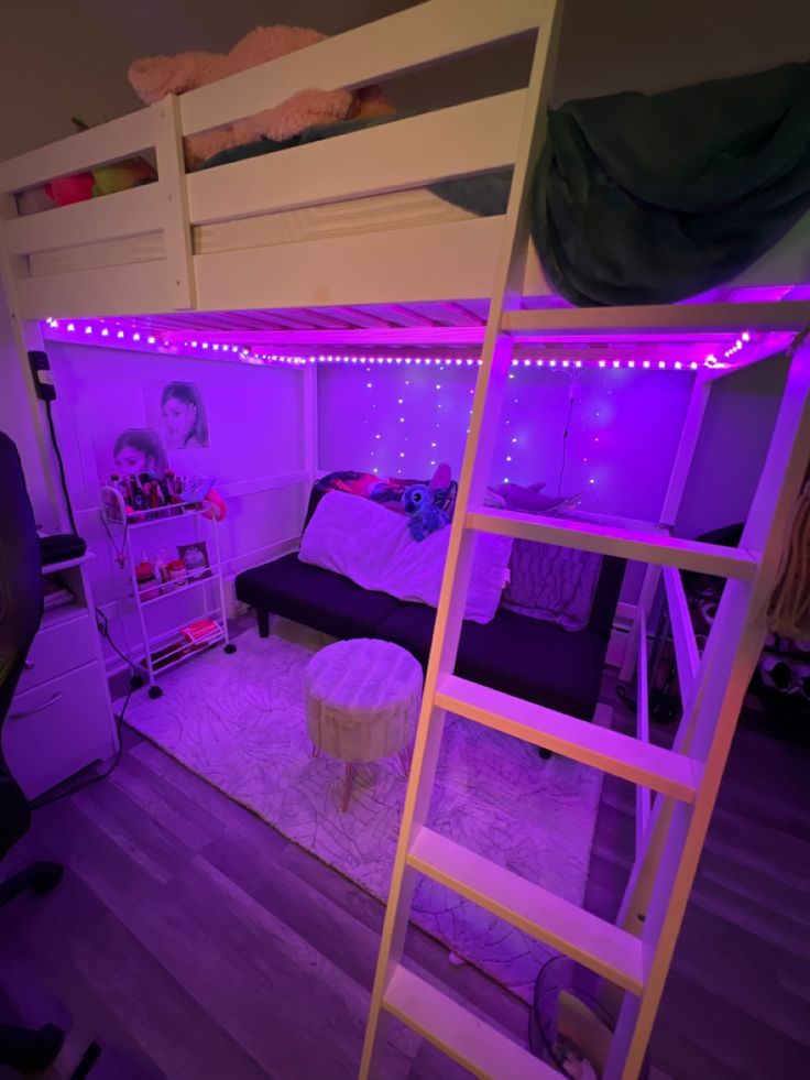 there is a loft bed with purple lights in the room and a ladder leading up to it