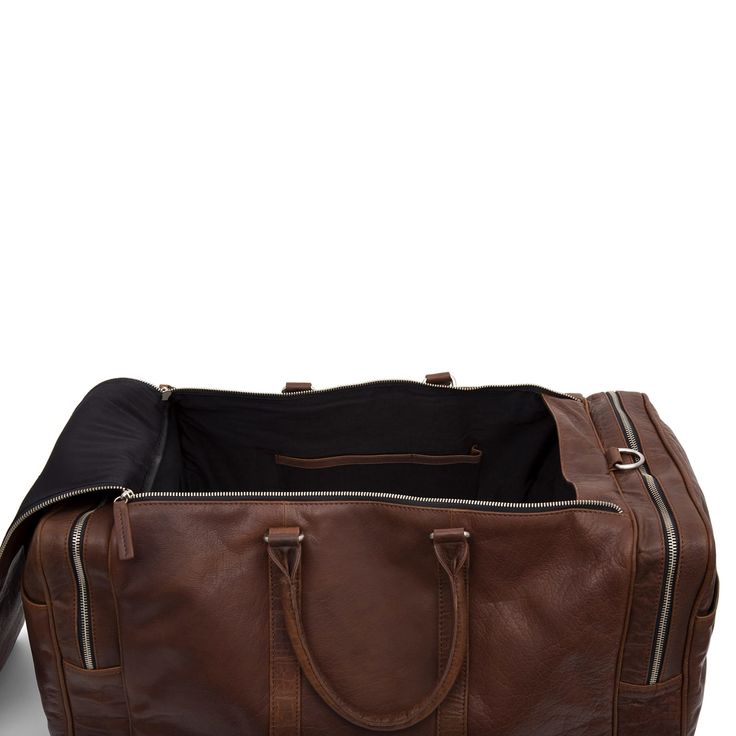 *  Travel bag in 100% genuine leather  
 *  Lots of storage  
 *  3 individual compartments  
 *  Delightful to touch   > Classic Leather-lined Luggage For Weekend Trips, Luxury Brown Luggage With Leather Lining, Brown Leather-lined Luggage For Travel, Brown Luggage With Leather Lining For Trips, Classic Brown Luggage For Overnight Trips, Classic Brown Travel Bag With Luggage Sleeve, Classic Brown Weekender Bag For Trips, Classic Brown Weekender Bag For Overnight Trips, Classic Cognac Luggage With Sleeve