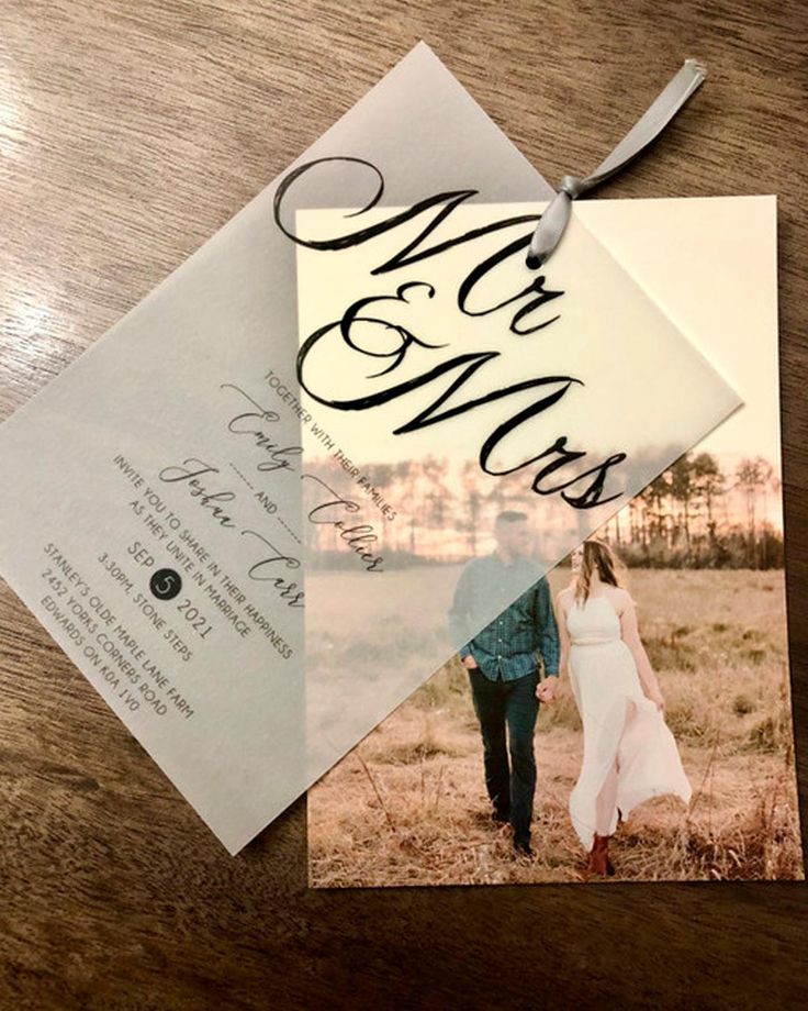 an open envelope with a wedding photo on it