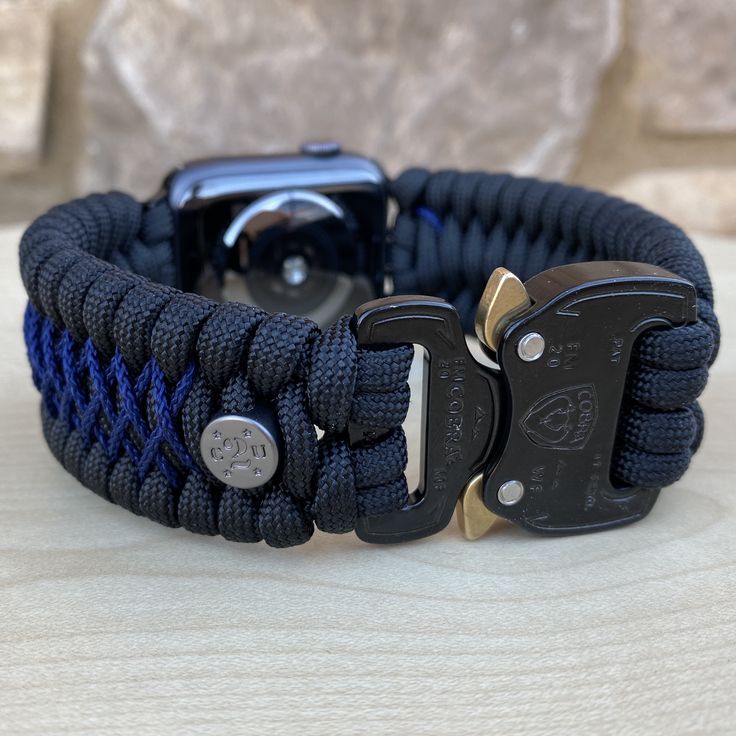 "FREE USPS PRIORITY MAIL SHIPPING FOR DOMESTIC US ORDERS (Includes U.S. Military APO/FPO Address Overseas) Thank you for visiting our shop \"Cording 2U\". A veteran owned business. Handcrafted Paracord wearables customized \"According To You\". Handcrafted with 100% Nylon Paracord \"MADE IN USA\" Our Products include: 🔹Custom handcrafted watch bands according to your wrist size, style, and color of choice. If you don't see it in our page yet, please contact us and we can discuss your options. ? Customizable Watch Bands, Black Paracord Bracelet Strap Watch Band, Customizable Custom Watch Accessories For Everyday Use, Durable Black Watch Bands For Customization, Durable Custom Watch Accessories For Everyday Use, Adjustable Black Watch Bands For Customization, Black Watch Bands With Bracelet Strap For Customization, Durable Adjustable Blue Watch Bands, Custom Black Apple Watch Band With Bracelet Strap