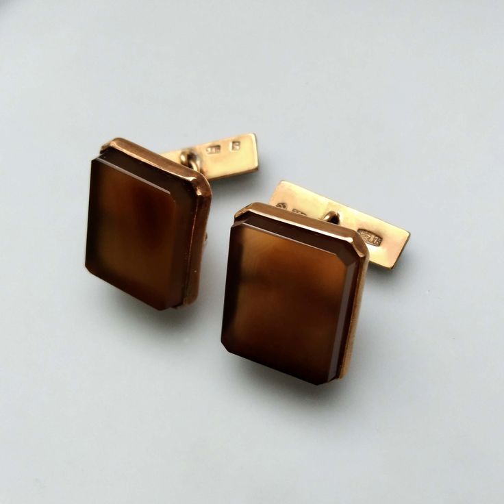 Thank you for visiting the SoChicFinds store - vintage and antique, costume and fine jewelry.  Square brown gemstone cufflinks with chain link closure. Metal: gold plated silver (vermeil).  Gemstone: square shaped brown chalcedony.  Weight of the chalcedony cufflinks: 7,11 grams. Hallmark: USSR, 1969, Purity of silver 875. Vintage cuff links in excellent condition. Square Brown Chalcedony Chain Link Cufflinks, Gold Plated Sterling Silver Cuff Link, 1960s Vintage 875 Silver  Jewelry for Men Art Deco Clip-on Jewelry For Formal Occasions, Formal Art Deco Clip-on Jewelry, Clip-on Art Deco Jewelry For Formal Occasions, Art Deco Formal Jewelry With Screw Back, Antique Screw Back Jewelry For Formal Occasions, Formal Art Deco Jewelry With Screw Back, Mid-century Polished Formal Jewelry, Victorian Screw Back Jewelry For Formal Occasions, Victorian Formal Jewelry With Screw Back