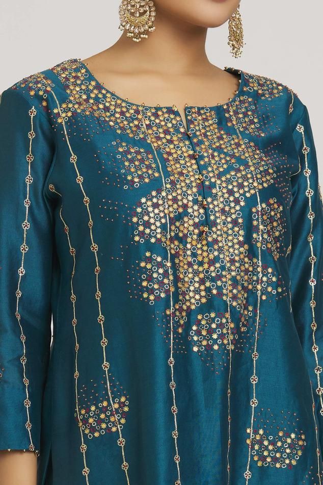 Cobalt blue kurta with bead and gota embroidered dot motifs. Comes with embroidered sharara and dupatta.
Components: 3
Pattern: Embroidered
Type Of Work: Zardozi, Bead, Gota
Neckline: Round
Sleeve Type: Three quarter
Fabric: Pure Silk Chanderi, Organza, Chiffon
Color: Blue
Other Details: 
Straight silhouette
Tassel detail
Occasion: Sangeet,Wedding - Aza Fashions Blue Silk Kurta For Festive Occasions, Festive Blue Silk Kurta, Elegant Blue Sharara For Festive Occasions, Transitional Blue Silk Choli, Blue Straight Kurta Set With Motifs, Blue Sets With Motifs And Straight Kurta, Transitional Silk Sharara With Motifs, Blue Silk Sets With Motifs, Festive Blue Sharara With Cutdana