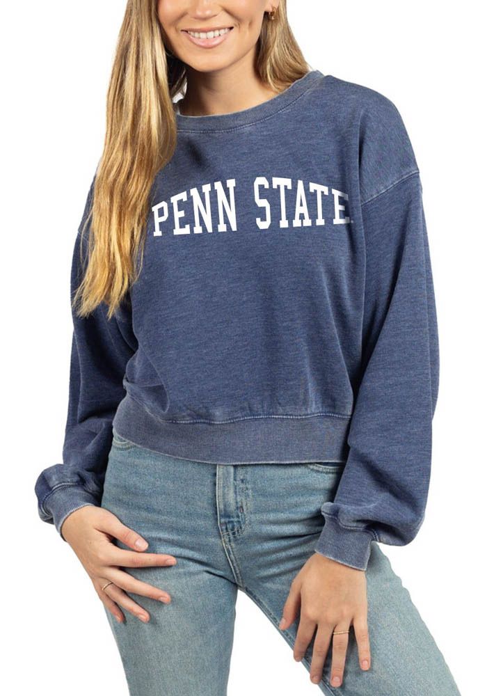 Make your way to the big game in this Penn State Nittany LionsWomens Navy Blue Campus Crop Crew Sweatshirt! This Nittany Lions Long Sleeve Sweatshirt features a screen print team name and logo. Stay warm and comfortable with this Womens Penn State Nittany Lions Crew Sweatshirt. Dropped shoulder, Crew neck, Puff sleeves, Straight hem, 60% COTTON / 40% POLYESTER, 4 Navy Long Sleeve Collegiate Top, Collegiate Relaxed Fit Tops For Campus, Collegiate Style Relaxed Fit Top For Campus, Navy Collegiate Crew Neck Top, Blue Fan Apparel Sweatshirt For Fall, Blue Casual Tops For Game Day, Blue Varsity Tops For Game Day, Blue Collegiate Sweatshirt For Campus, Blue Varsity Top For Winter