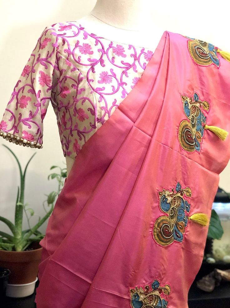 These pure silk vibrant blouses feature all over delicate thread embroidery, in geometric and floral designs. The sleeves are finished with pearl or gold seed bead trim. Hook and loop enclosures provided on the front, run down the length of the top. Blouses come in a size 36-38 (M-L) and have extra fabric and stitches along the inseams of sleeves and bust for easy alteration up to size 42. Note: The last image is of 2 different blouses, displayed as one. FREE STANDARD SHIPPING! Shipping outside Designer Wear Floral Embroidered Blouse, Designer Multicolor Floral Embroidered Blouse, Festive Tops With Geometric Embroidery, Multicolor Resham Embroidery Blouse For Transitional Season, Multicolor Resham Embroidered Blouse For Transitional Season, Bohemian Blouse With Motifs For Transitional Season, Bohemian Embroidered Saree Blouse, Transitional Multicolor Blouse With Resham Embroidery, Festive Embroidered Top With Multicolor Motifs