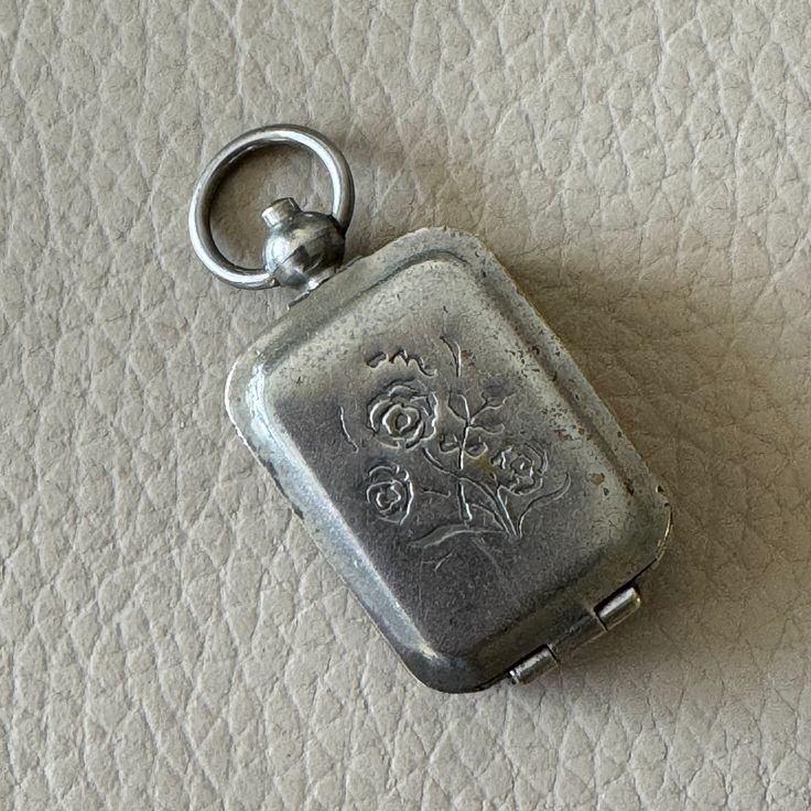 This is an vintage locket. Made circa 1940 of silver plated brass . It has an etched flower design on the front. The locket is opened by pressing a button on the top. It is of the type that would have a keepsake such as a lock of hair. There is spotting to the plating see photos . 4.5 x 2cm We have a wide range of antique and vintage items in our shop and will be happy to combine shipping costs. Please take a look at our other items. About us  Classic Brocante is a husband and wife team, Franc a Antique Silver Vintage Locket Necklace For Anniversary, Vintage Nickel Free Antique Silver Locket Necklace, Vintage Antique Silver Locket Necklace Nickel Free, Vintage Antique Silver Locket Necklace, Vintage Antique Silver Locket Necklace For Anniversary, Antique Silver Vintage Locket Necklace, Vintage Silver Locket Necklace With Charms, Antique Silver Locket Necklace With Charms, Silver Vintage Locket Necklace With Charms