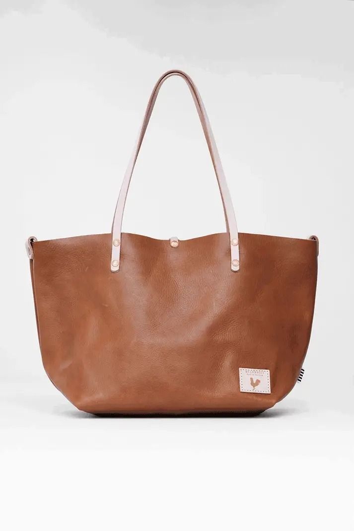 Saddle Leather Perfect Tote | Saddle Leather Purse Raw Leather, Tan Cowhide, Saddle Leather, Leather Interior, Saddle, Soft Textures, Leather Purses, Solid Brass, Zip Pockets