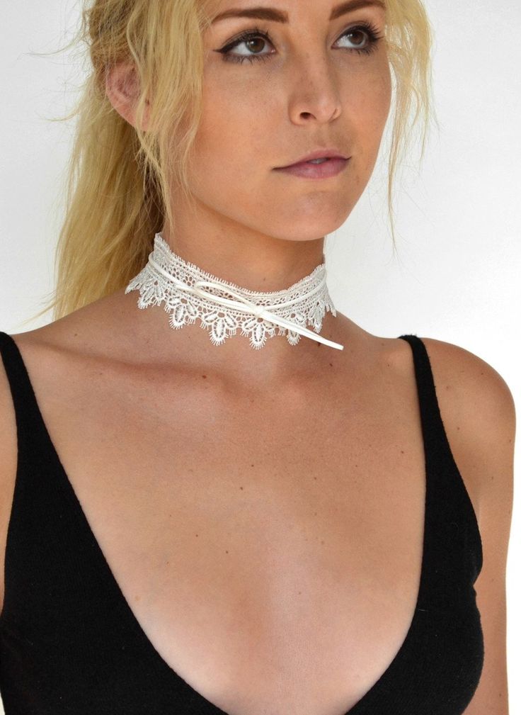 DETAILS: Wide lace choker necklace available in black and white Bow tie detail Bow tie can be adjusted Choker measures approx. 12" length, with a 2" extension 1 3/4" wide Gold plated lobster claw closure Adjustable Lace Choker For Party, Adjustable White Choker For Festival, Elegant White Choker For Festivals, White Choker For Festivals, Elegant White Choker For Summer, Elegant White Summer Choker, White Adjustable Choker Jewelry, Adjustable Lace Trim Choker, Adjustable Lace Jewelry For Parties