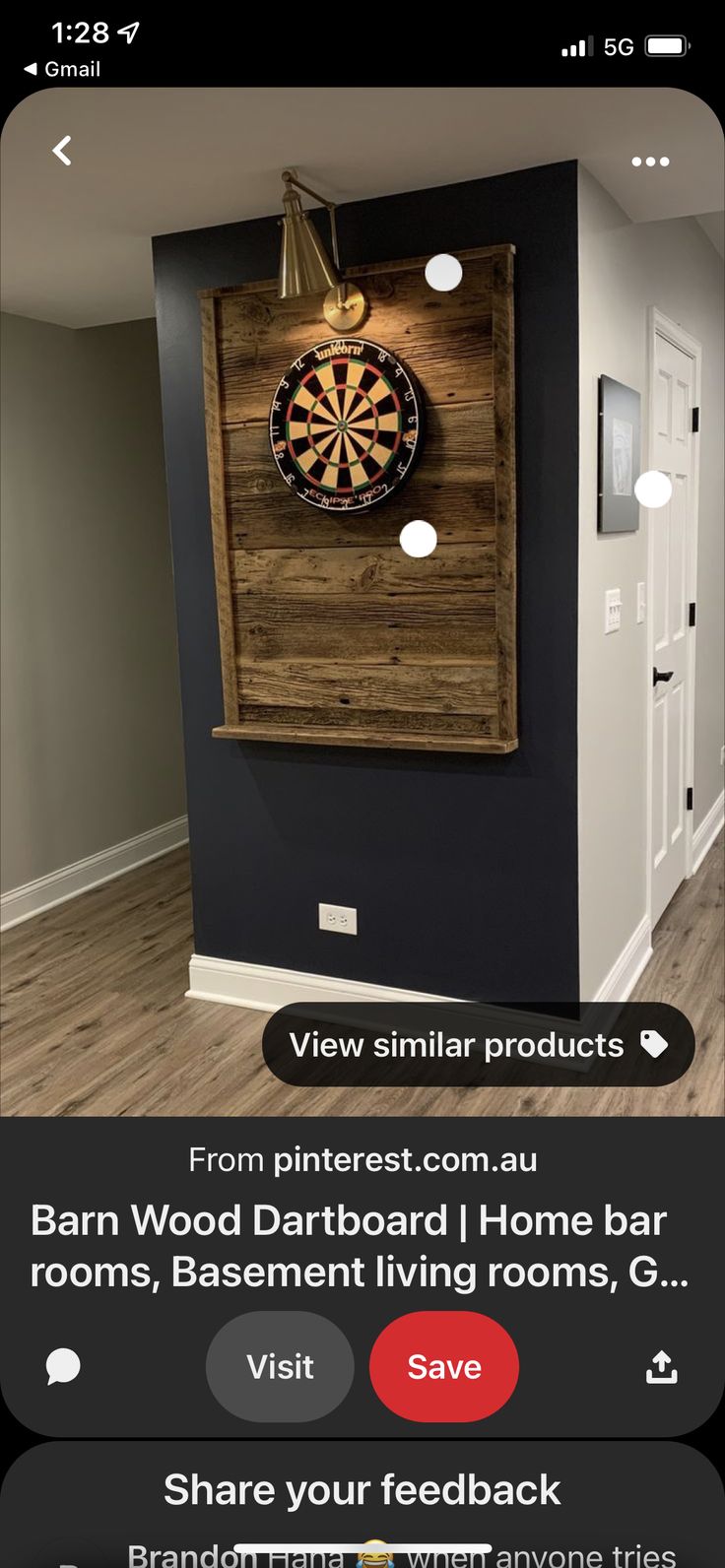 a room with a dart board on the wall next to a door and a sign that says, barn wood dartboard game room basement home bar rooms