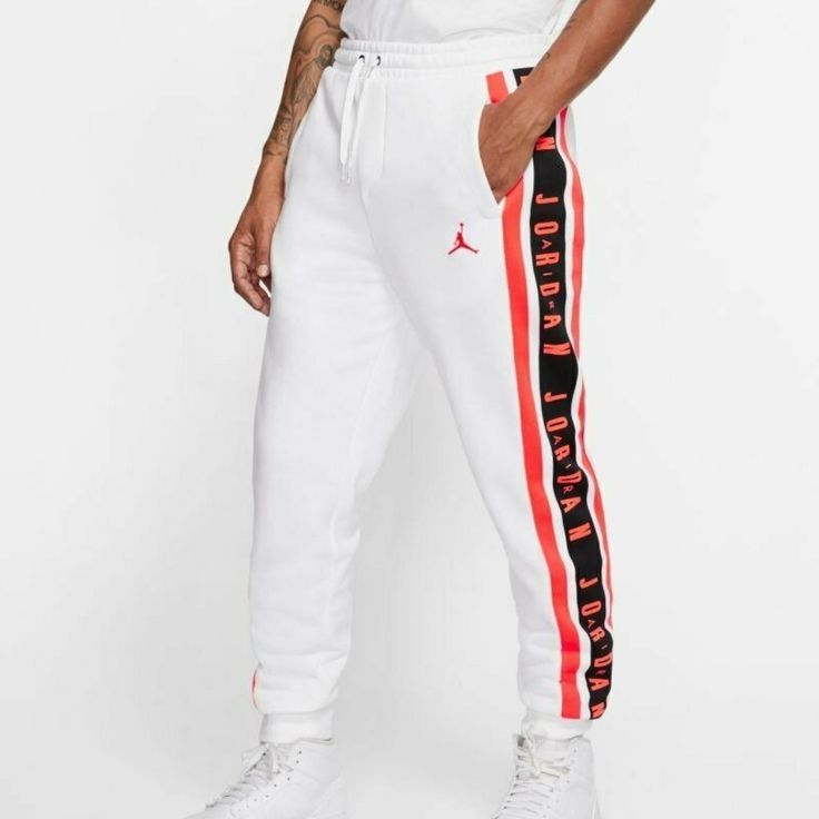 New Nike Air Jordan Air Gradient Pants White Infrared Mens Drawstring Closure French Terry Fleece Has A Cozy Feel To Help Keep You Comfortable In Cool Weather. A Stretchy Drawcord Waistband And Ribbed Cuffs Give A Comfortable, Personalized Fit. A Taped Air Jordan Logo Down The Leg Celebrates Mj’s Legacy. Standard Fit For A Relaxed, Easy Feel 80% Cotton / 20% Polyester White Sweatpants With Three Stripes For Sports, Sporty White Bottoms With Side Stripes, White Bottoms With Three Stripes Branding For Spring, White Sportswear Pants With Three Stripes Branding, White Athleisure Bottoms With Side Stripes, White Adidas Sportswear Bottoms, Sporty White Joggers With Three Stripes Branding, Sportswear White Pants With Side Stripes, White Sportswear Bottoms With Three Stripes