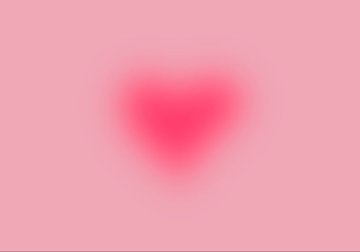 a red heart on a pink background