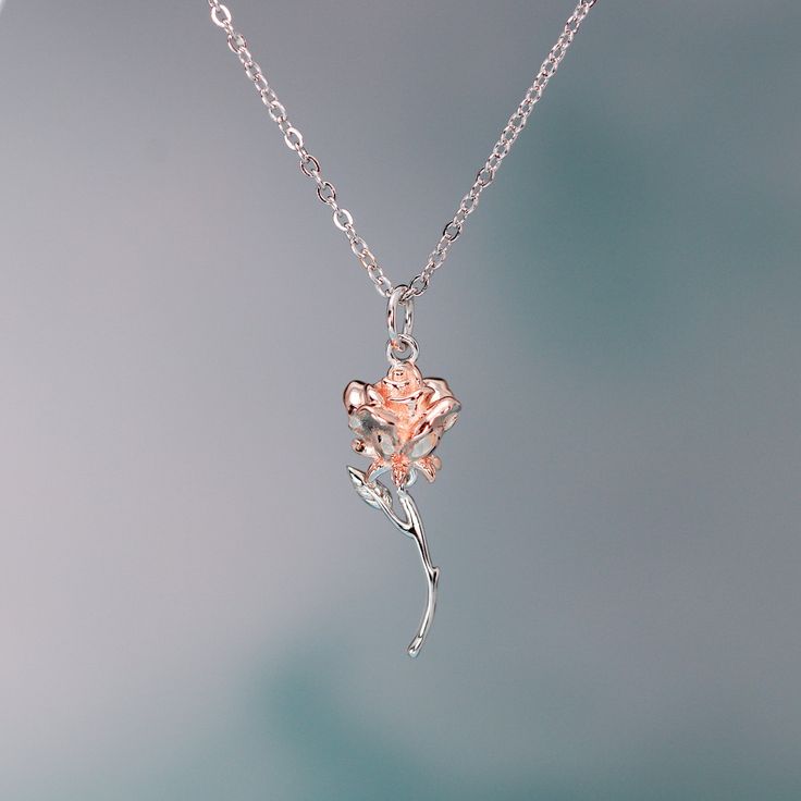 This exquisite rose pendant necklace showcases a 3D rose in 925 sterling silver with rose gold plating for a stunning flower color. It hangs delicately on a 925 sterling silver cable pendant with an adjustable ball. Make this elegant rose pendant necklace a part of your everyday fine jewelry collection, or gift it to a loved one for a special occasion. Materials: 925 sterling silverFinish: platinum plate, rose gold plateMaximum length is 17.5 inches, can be adjusted shorter using the adjustable ball. Jewelry Care: See more information about how to care for your jewelry here. Shipping Policy: Orders will be shipped within 1-3 business days. Economy shipping will take 7-14 days to arrive and standard shipping is 1- 4 days for U.S. orders. International shipping time is depended on the countr Rose Gold Flower Pendant Necklace With Clavicle Chain, Rose Gold Pendant Flower Necklace With Clavicle Chain, Rose Gold Clavicle Chain Flower Pendant Necklace, Rose Gold Flower Pendant Clavicle Necklace, Rose Gold Flower Pendant Necklace With Delicate Chain, Rose Gold Clavicle Chain Necklace With Flower Pendant, Delicate Rose Gold Flower Necklace With Clavicle Chain, Dainty Rose Gold Flower Necklace With Clavicle Chain, Rose Gold Flower Shaped Necklace As Gift For Her