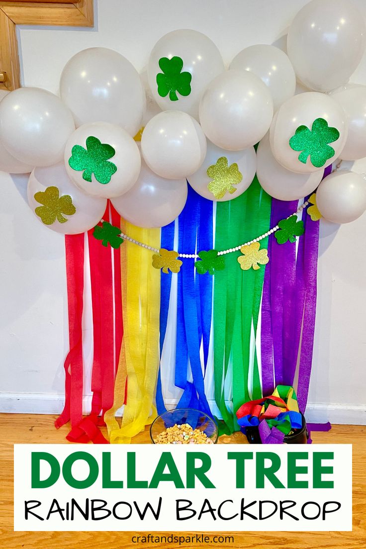 dollar tree rainbow backdrop with balloons and streamers for st patrick's day party