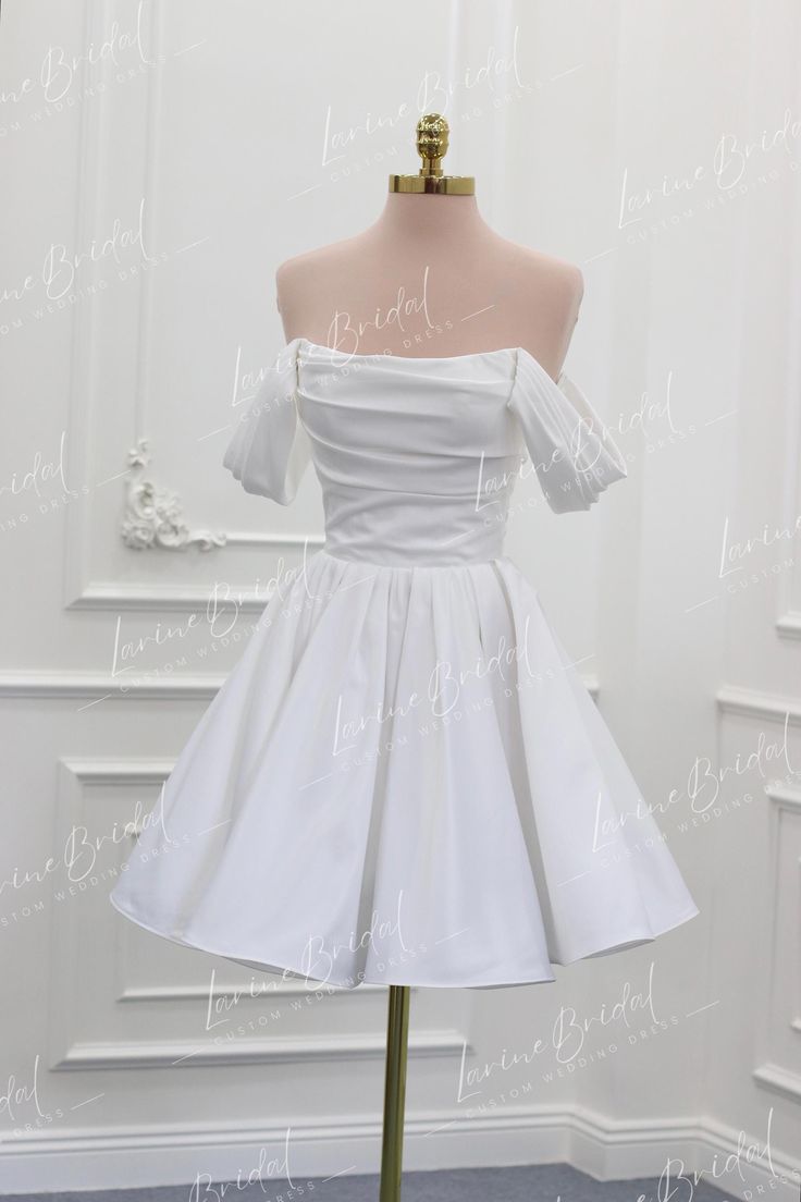 a short white dress on a mannequin