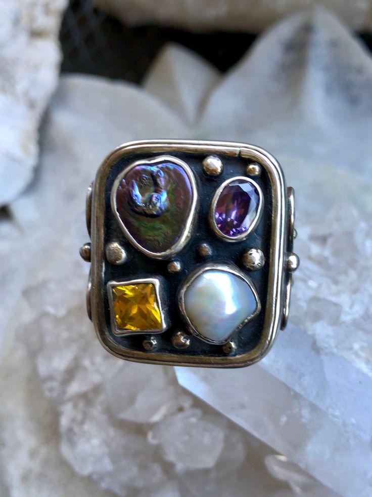 Bold Beautiful Solid Sterling Silver Pearl Amethyst Citrine Vintage Ring Wonderfully crafted, hight quality Ring is currently a size 7 with the custom made ring guard, ring guard can be removed for an additional 2 ring sizes weighs 25 Grams Artistic Accessories, Guard Ring, Vintage Silver Ring, Pearl Amethyst, Ring Guard, Vintage Silver Rings, Usa Jewelry, Handcrafted Necklace, Ring Sizes