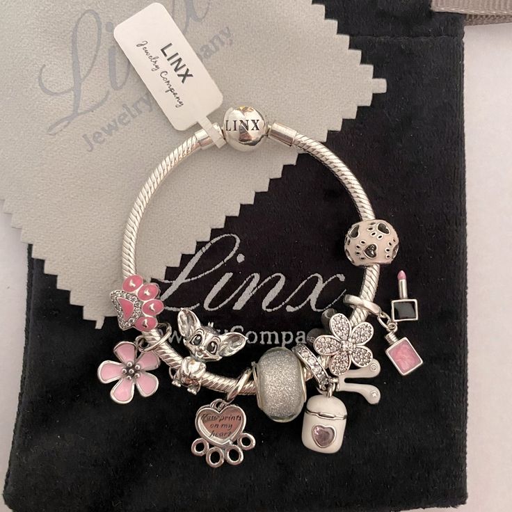 the charm bracelet is decorated with charms