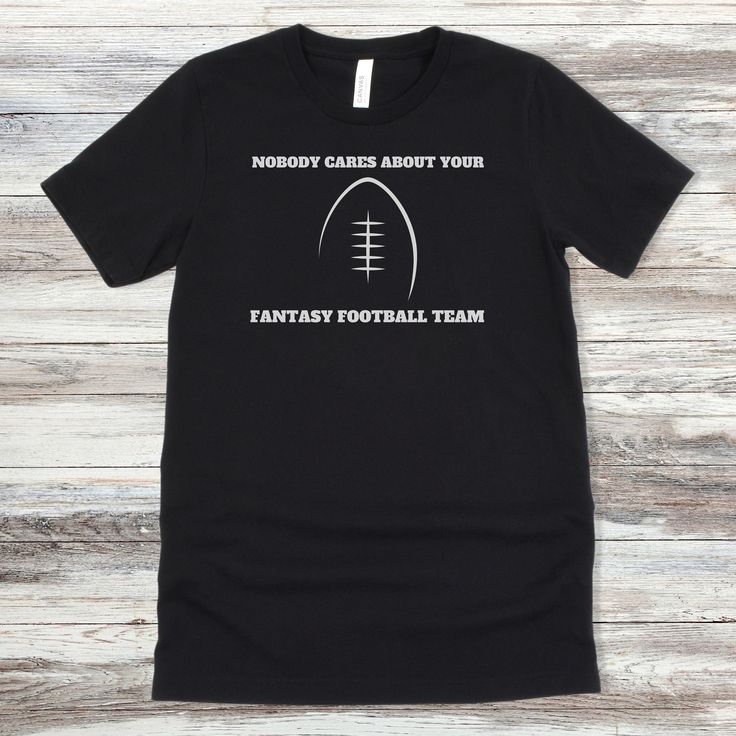 This Fantasy Football shirt makes the perfect gift for him whether it be for Father's Day, his birthday, or draft day.  All Fantasy Football lovers will appreciate it! This classic unisex jersey short sleeve tee fits like a well-loved favorite. Soft cotton and quality print make users fall in love with it over and over again. These t-shirts have-ribbed knit collars to bolster shaping. The shoulders have taping for better fit over time. Dual side seams hold the garment's shape for longer.  .: 100 Father's Day Team Spirit T-shirt With Crew Neck, Father's Day Team Spirit Crew Neck T-shirt, Father's Day Sports Fan T-shirt With Letter Print, Fan Apparel T-shirt For Game Day On Father's Day, Father's Day Fan Apparel T-shirt With Team Name, Father's Day Game Day Fan Apparel T-shirt, Game Day Team Spirit T-shirt For Father's Day, Father's Day Team Spirit Graphic T-shirt, Father's Day Game Day T-shirt With Team Spirit