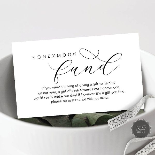 a white bowl filled with flowers next to a card that says honeymoon fundd on it