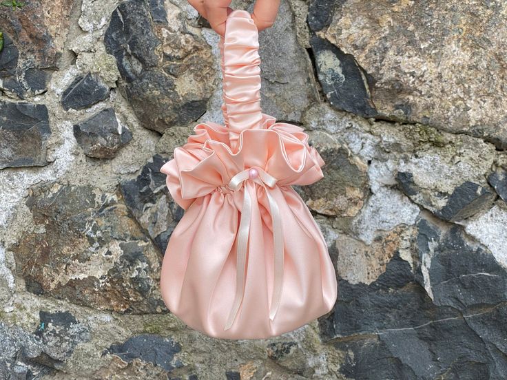 🔘 This Elegant Satin Ruffle bag is ideal for the wedding day, night out, party, special occasion, brides, bridesmaids, mothers of the bride, or any formal fun. 🔘 This bag has an elastic opening and a stiff bottom.   🔘 Please contact us for a custom order. 🔘 Material: Satin fabric, lace. The lining fabric is the same fabric as on the outside.  🔘 Measurements: The bottom diameter is 15 cm/6 inches & Height is 19 cm /7.5 inches 🔘 Care instruction: Hand wash in Luke water. Blush Rectangular Bag For Parties, Blush Rectangular Party Bag, Rectangular Blush Party Bag, Pink Pouch Evening Bag For Wedding, Pink Feminine Wedding Bag, Pink Feminine Wedding Bags, Feminine Pink Wedding Bag, Feminine Pink Wedding Bags, Elegant Pink Pouch For Party