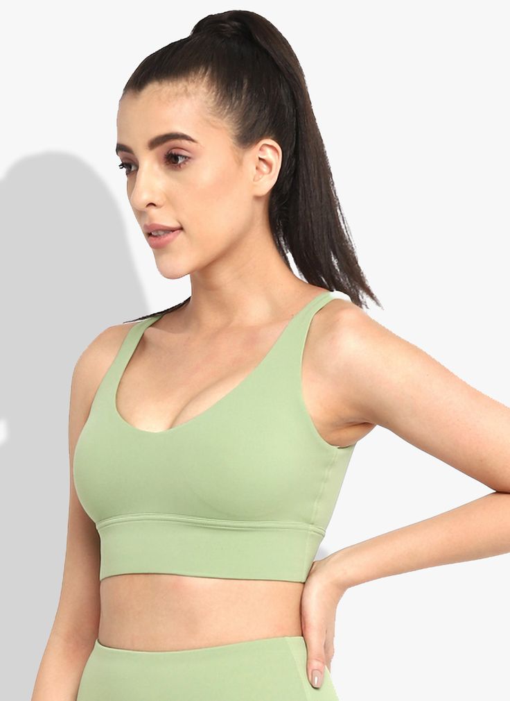 Unleash your inner strength and confidence with the Verdant Vitality Sports Bra. This light green masterpiece isn't just a sports bra—it's a symbol of empowerment and resilience. Crafted for those who push boundaries and redefine limits, it combines exceptional support with unparalleled comfort, ensuring you stay focused on your goals. Green Sports Bra, Sporty Bra For Yoga, Green Medium Support Sports Bra For Gym, Green Activewear For Light Exercise, Green Sports Bra With Medium Support For Gym, Supportive Solid Color Sports Bra For Pilates, Supportive Light Support Sports Bra For Light Exercise, Supportive Seamless Sports Bra For Light Exercise, Sports Bra With Light Support For Light Exercise